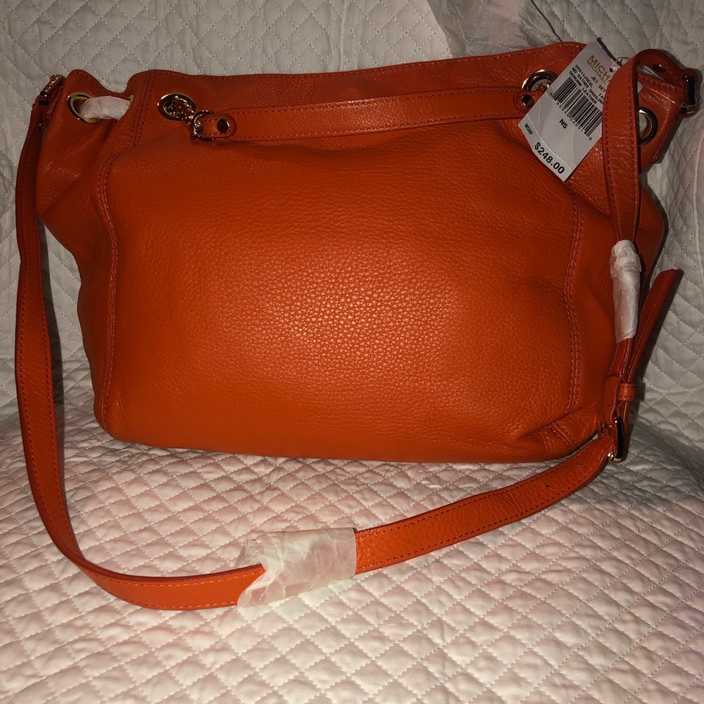 New Michael Kors leather handbag in Orange .